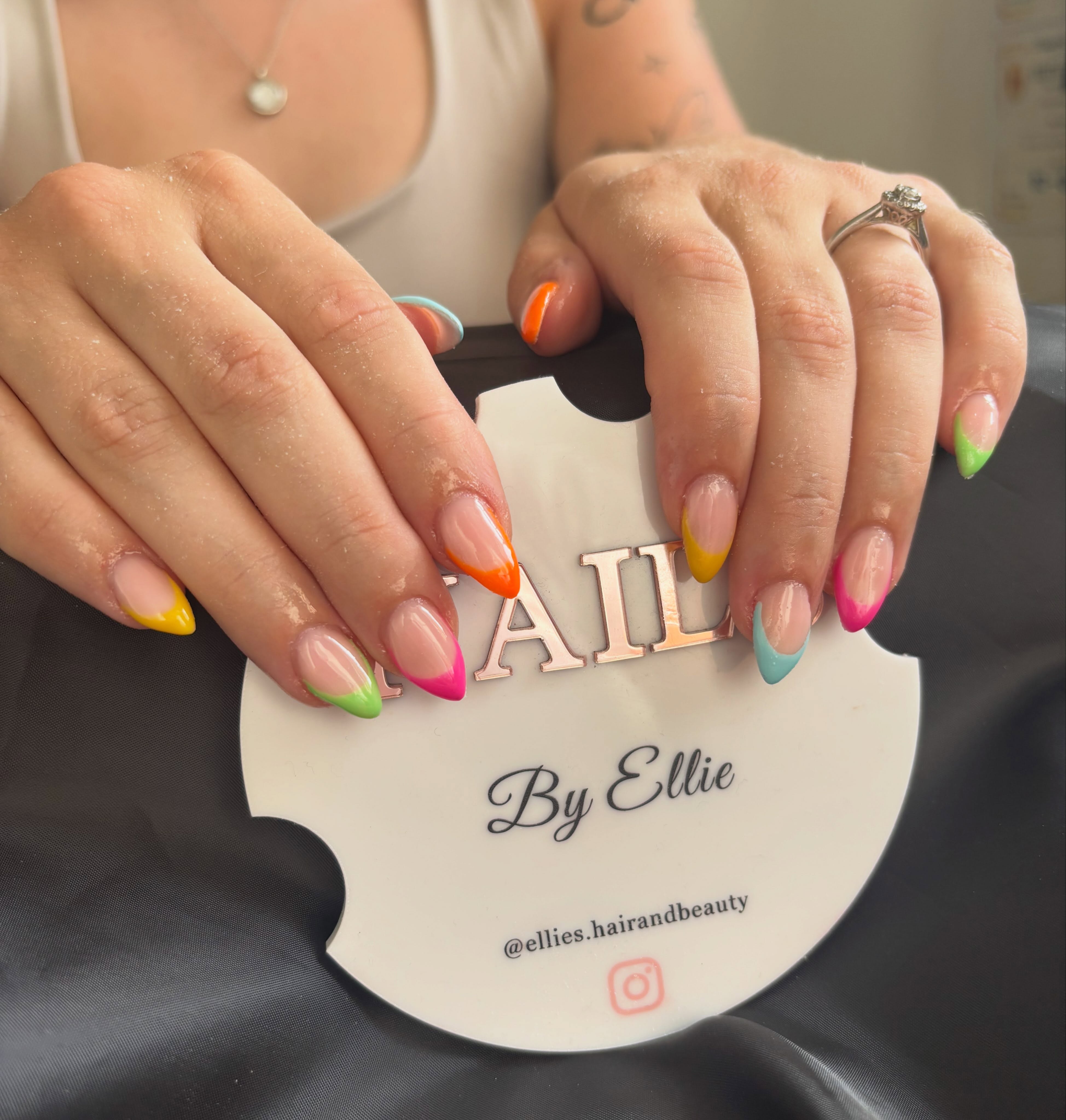 Colourful rainbow French tip nails by Ellie's Hair & Beauty